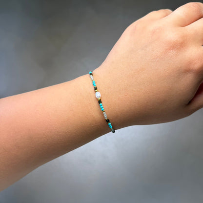 Pulsera Perla Turquesa Acero Baño Oro